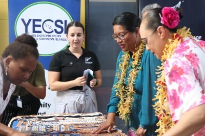 New Zealand Minister for Pacific Peoples, Hon. Barbara Edmonds viewing shell moneys at the Multi Purpose Youth Hall.